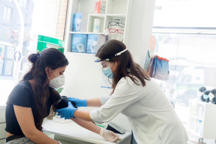 A person wearing a mask and gloves Description automatically generated with low confidence